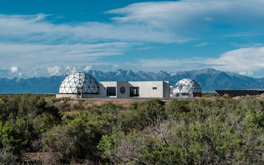Kosmos Stargazing Resort's domes under a mountain sky